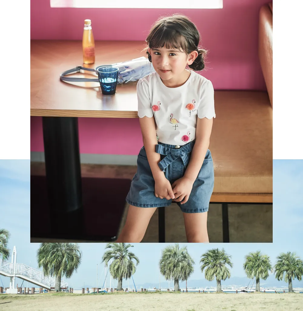 BeBe ロゴプリントTシャツを着用した男の子モデル